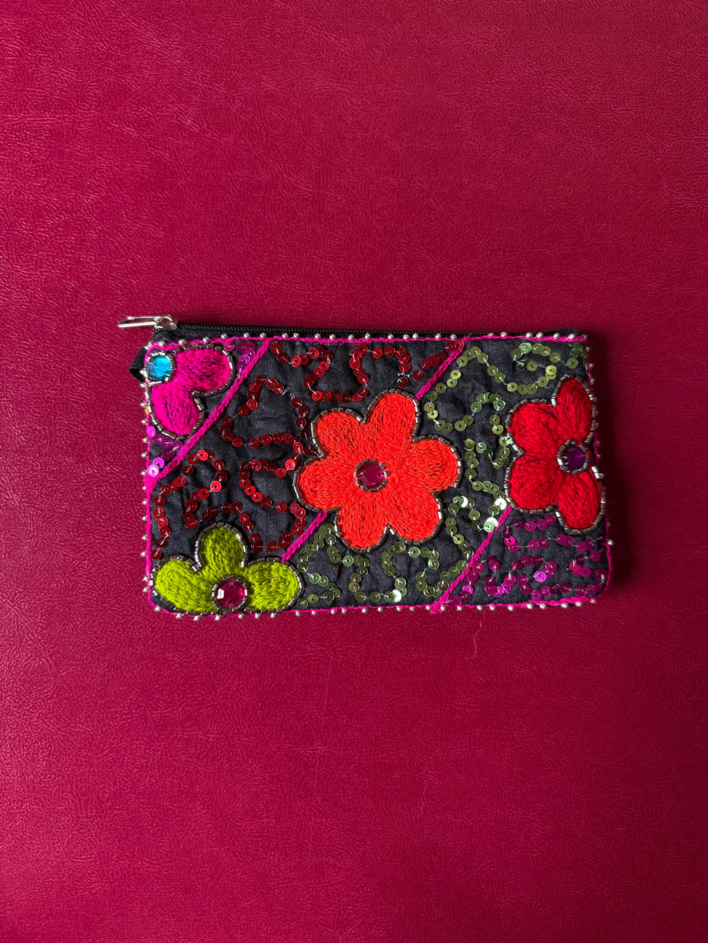 Flower embellished pouch