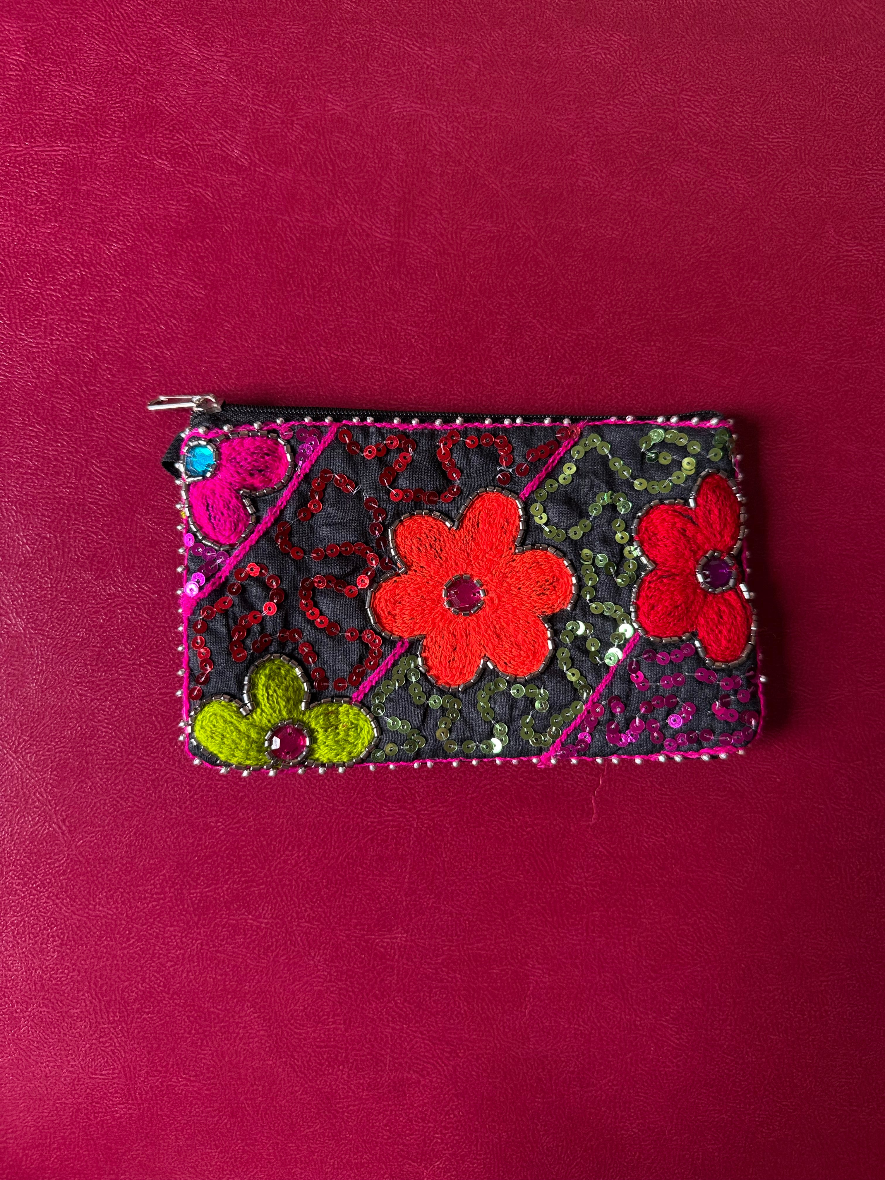 Flower embellished pouch