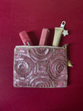 Pink embellished pouch