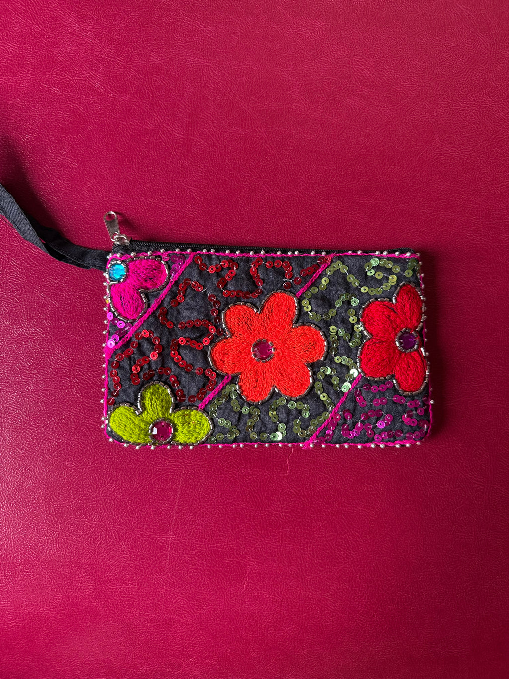 Flower embellished pouch