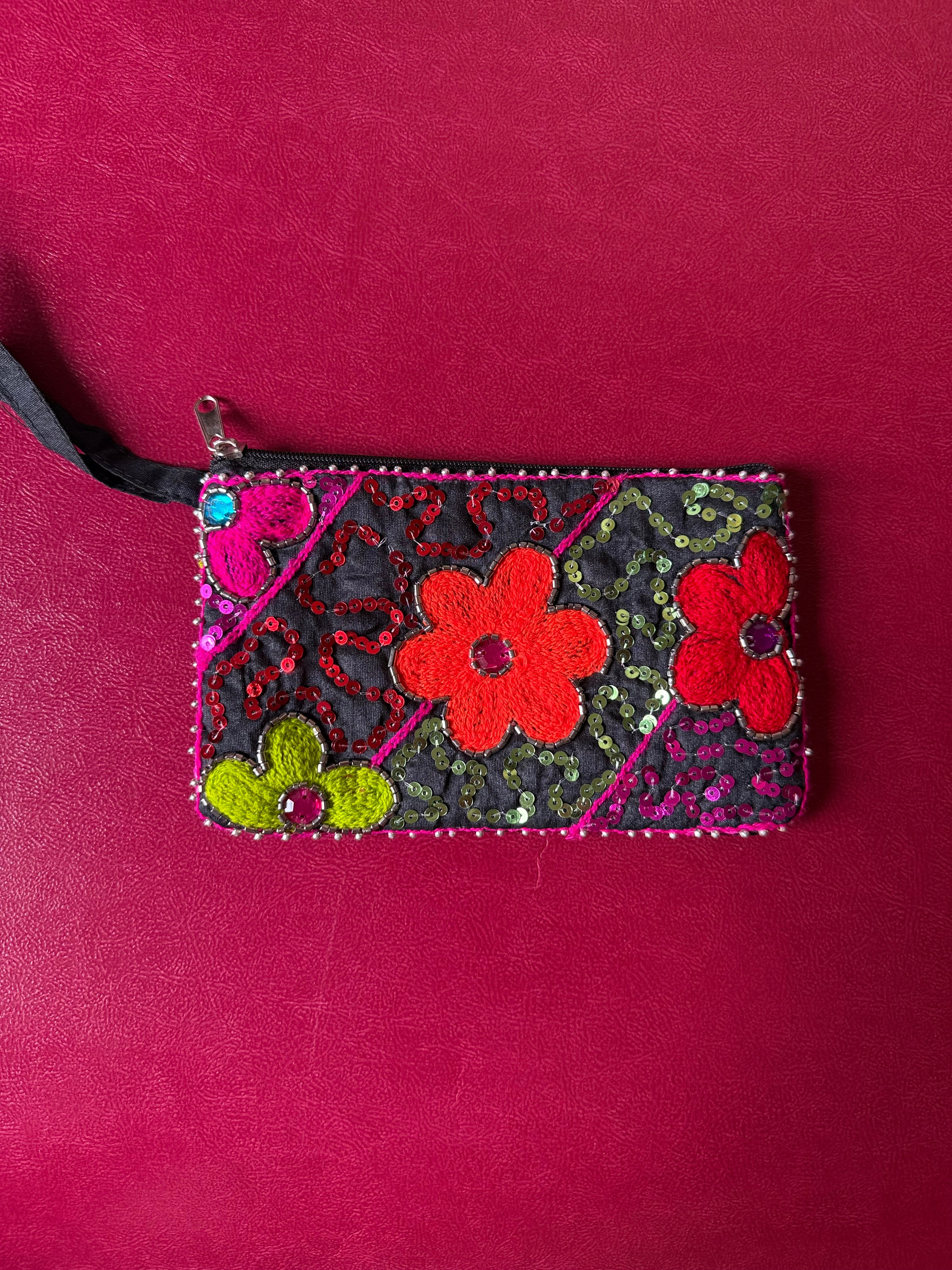 Flower embellished pouch