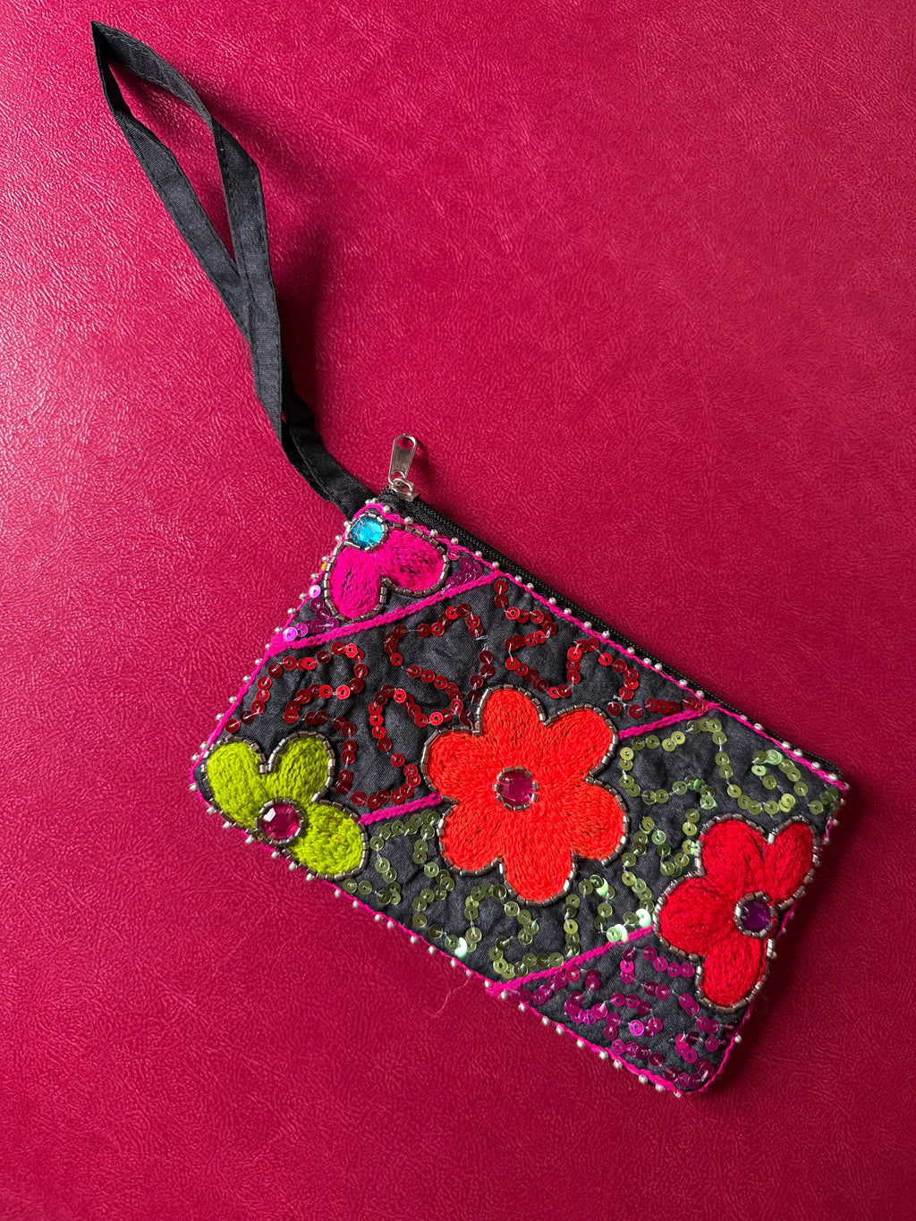Flower embellished pouch